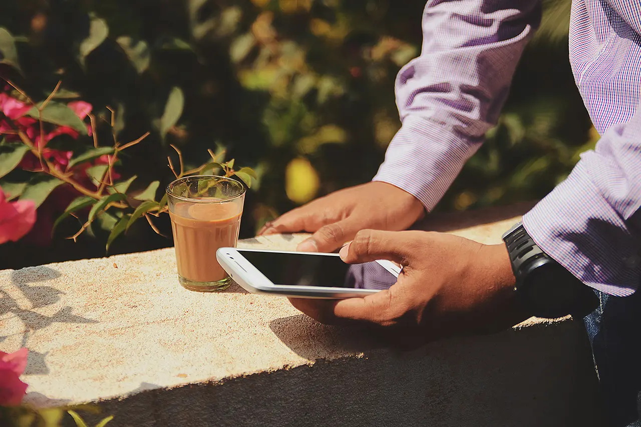 Man using mobile phone in a garden
